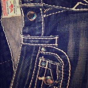 True Religion jeans w/ blue Swarovski detail. 25